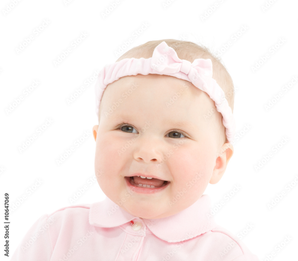 Happy face of baby girl with bowknot on head