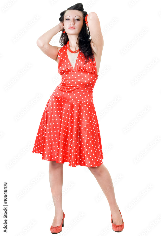 The young beautiful brunette in a red dress The young beautiful brunette in a red dress
