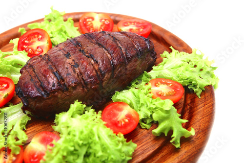 roast meat on wooden plate