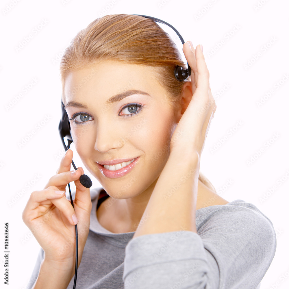 Beautiful girl is using headset, she isolated on white Beautiful girl is using headset, she isolated on white