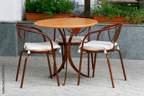 table and chairs in street cafe