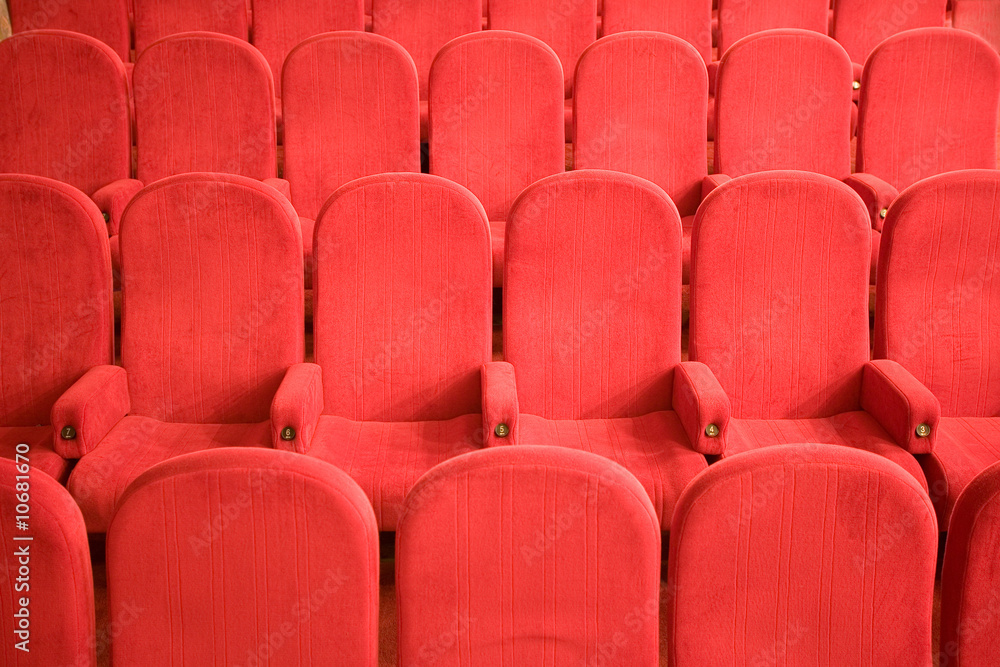Fototapeta premium red chairs in the empty small cinema auditorium