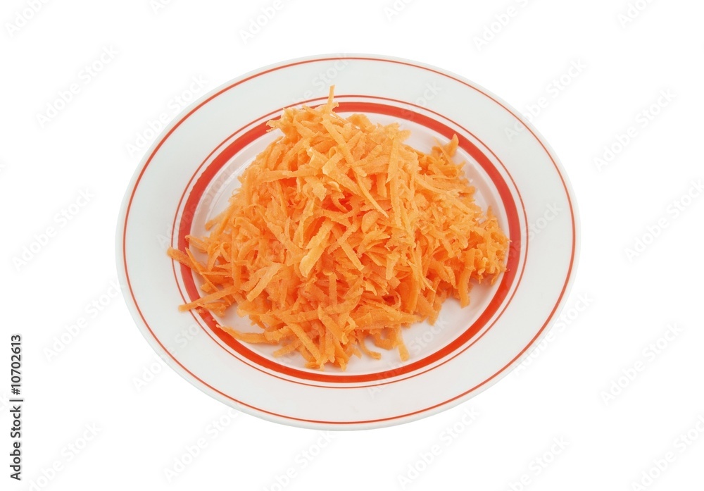 Fresh grated carrot on plate isolated Fresh grated carrot on plate isolated