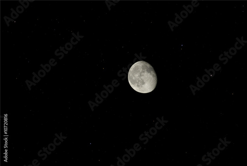 The moon with moving stars behind