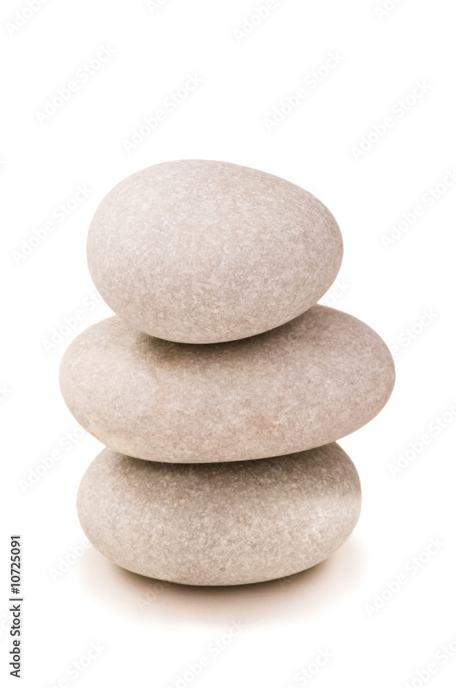 Fototapeta premium Stack of pebbles isolated on the white background