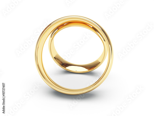 Wedding golden rings one over another. Isolated.