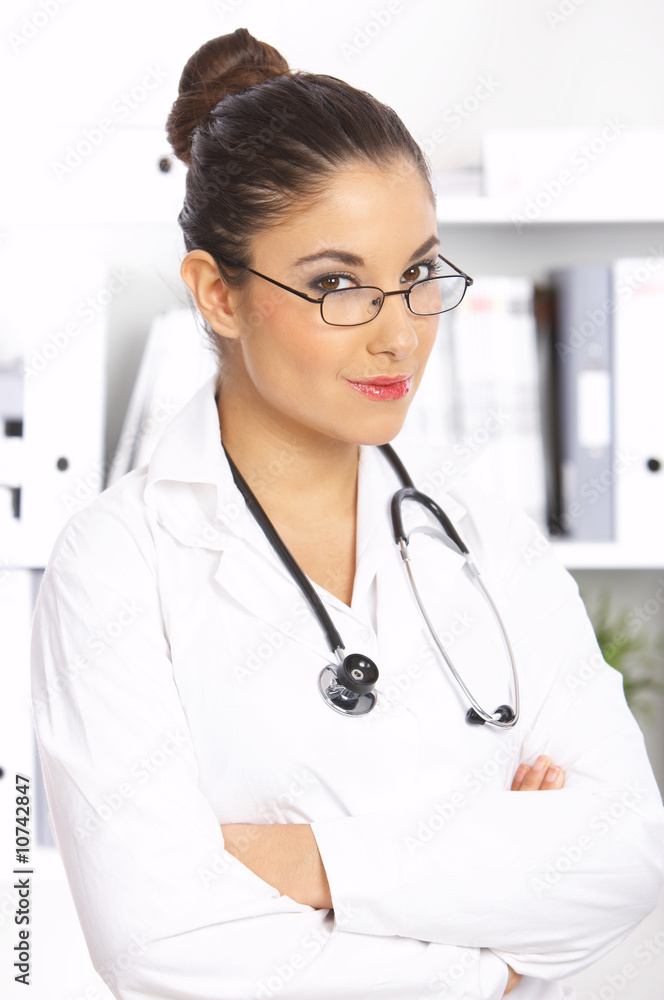 Portrait of female doctor standing in surgery Portrait of female doctor standing in surgery