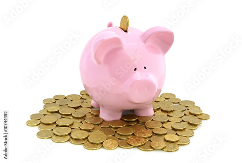 Piggy Bank with golden coins photo