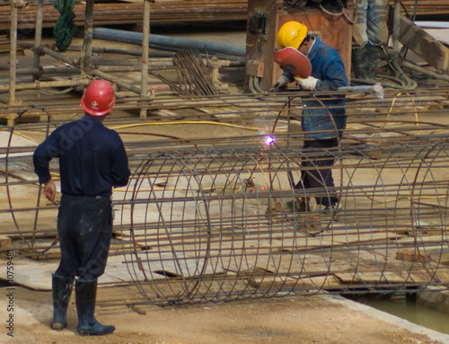 welder at construction site photo