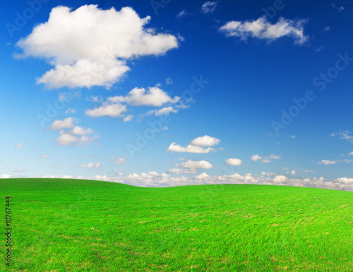 green field and blue sky whit white clouds