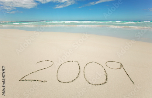 Year 2009 written on tropical beach