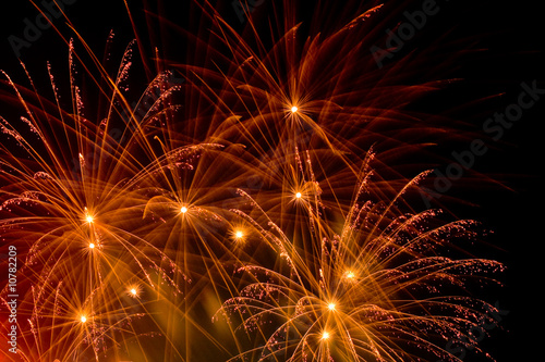 bright-red streaks of multiple burst fireworks