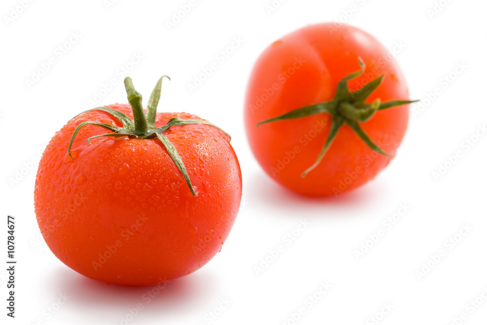 two ripe tomatoes isolated