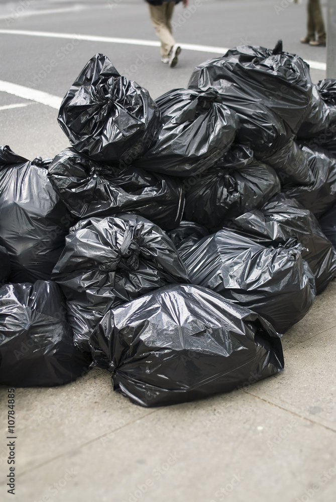 Bunch of garbage bags on street Bunch of garbage bags on street