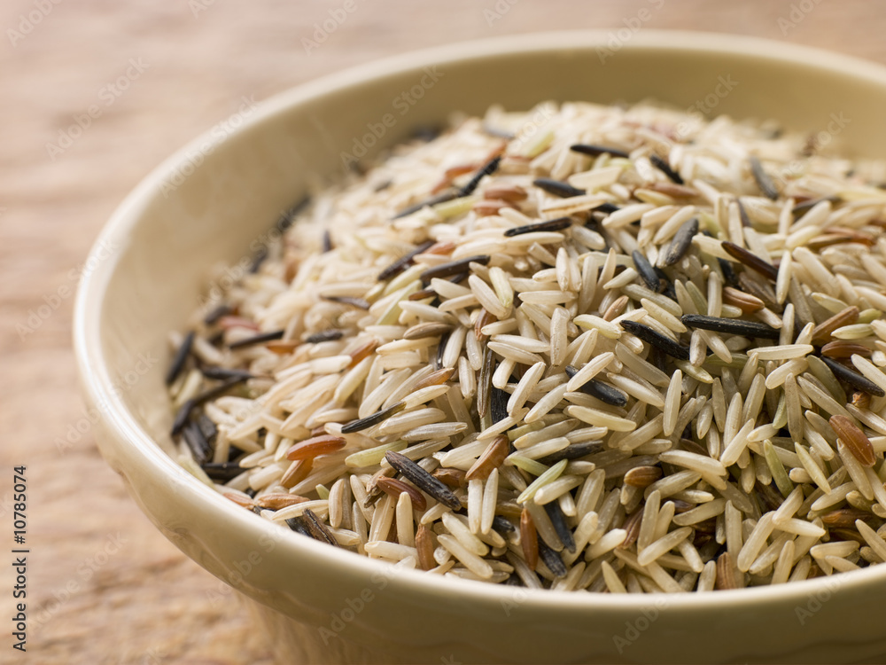 Bowl Of Uncooked Wild, Basmati And Red Carmague Rice Bowl Of Uncooked Wild, Basmati And Red Carmague Rice