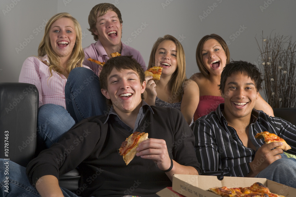 Teenagers Having Fun And Eating Pizza Teenagers Having Fun And Eating Pizza