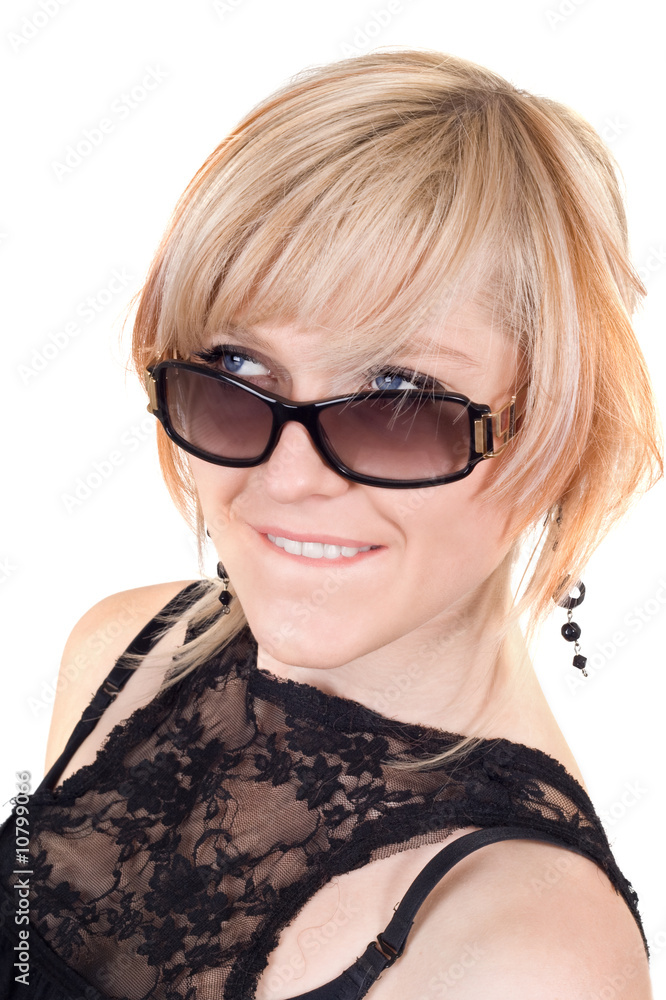 The blonde in sunglasses with a crafty sight. Isolated The blonde in sunglasses with a crafty sight. Isolated