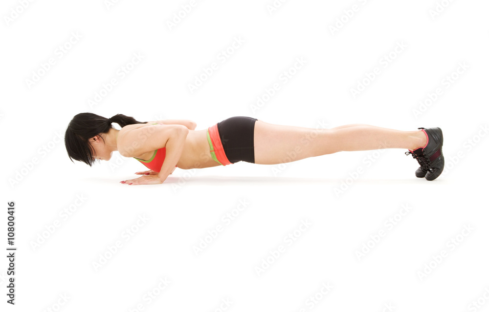 woman practicing four-limbed staff pose woman practicing four-limbed staff pose