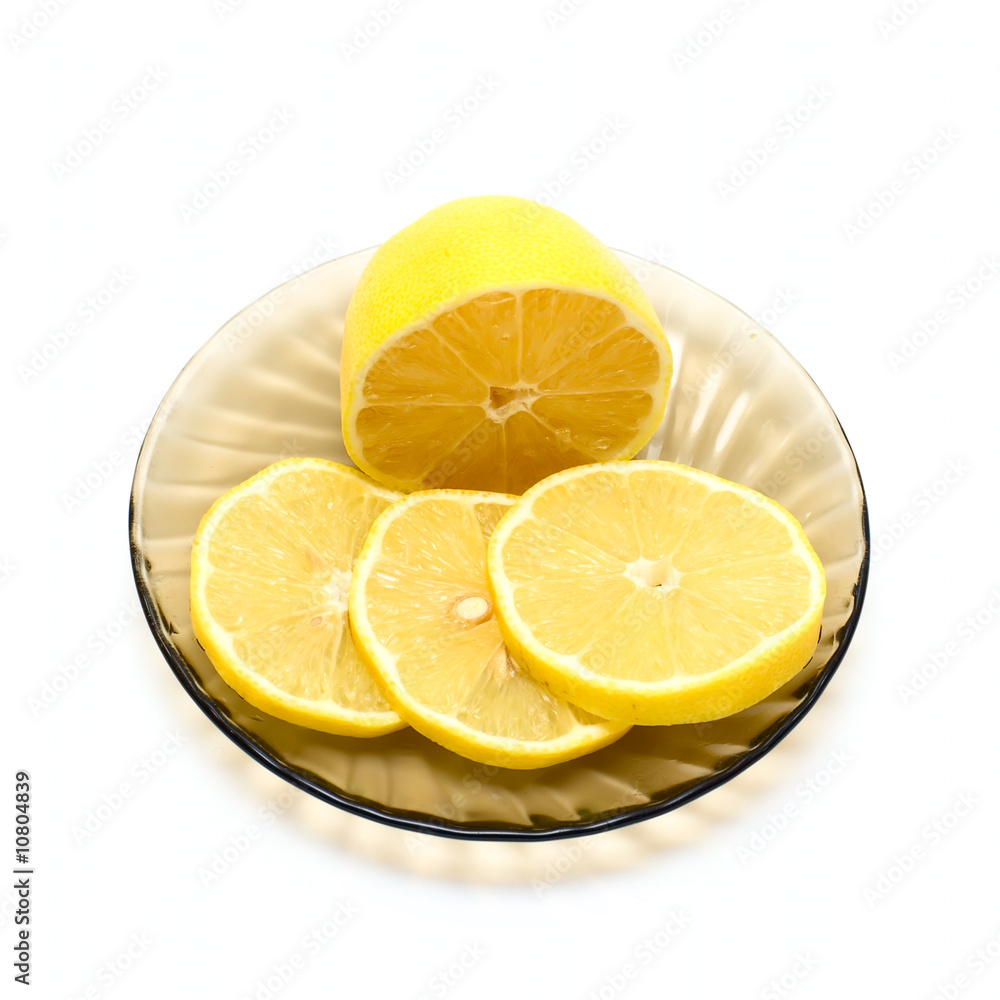 Lemon and lemon slices on plate Lemon and lemon slices on plate