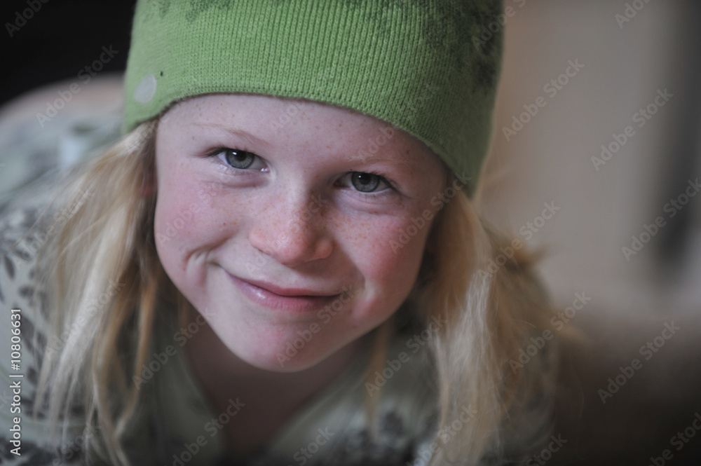 Little girl in a green wool cap. Little girl in a green wool cap.