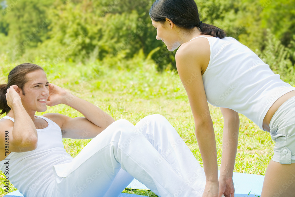 Fototapeta premium Young couple on outdoors workout together