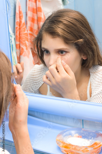 Teen girl in bathroom