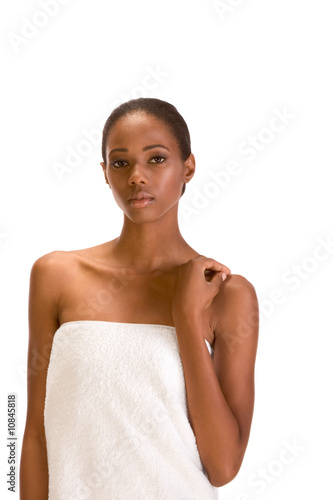 Afro-American girl wrapped in white bath towel