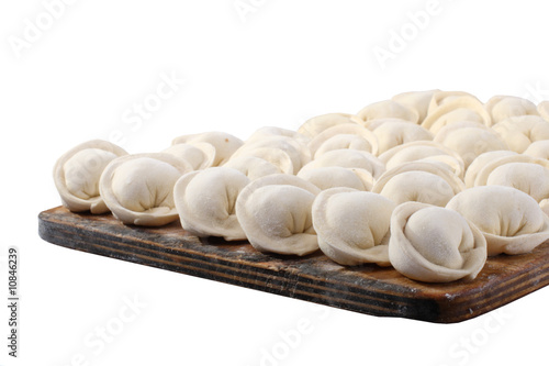 Russian pelmeni on a board