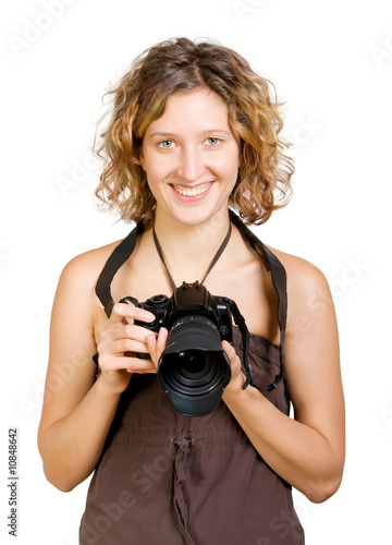 Young beautiful smiling woman holding a photo camera