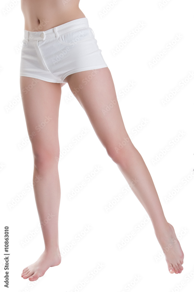 Beautiful female legs isolated on a white background Beautiful female legs isolated on a white background
