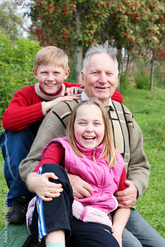 grandfather with children outdoor
