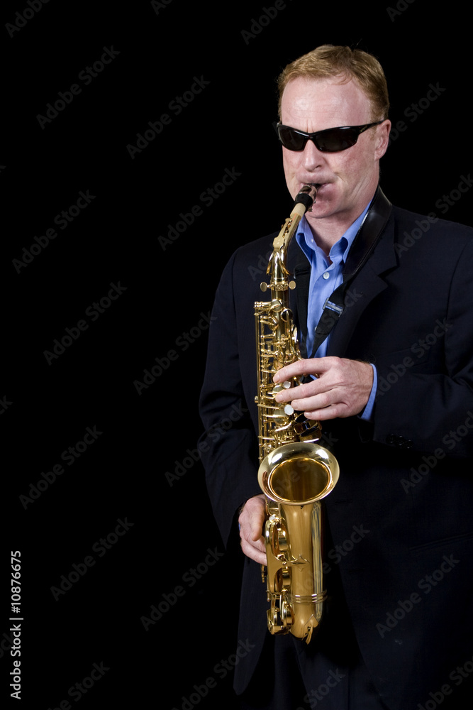 Naklejka premium jazz musician playing saxophone