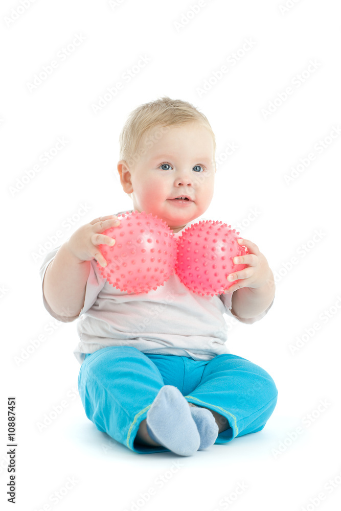 Portrait of little boy with two pink massage balls