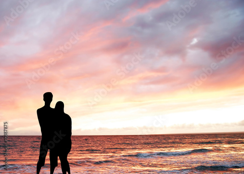 couple silhouette at sea sunset background