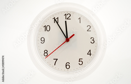 Wall clock showing five to twelve