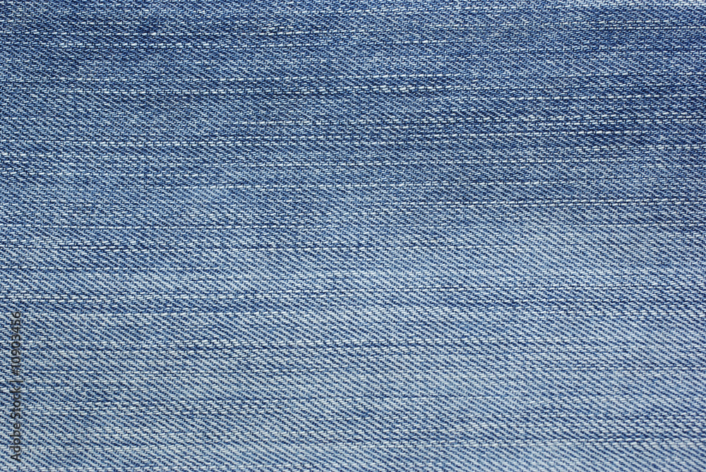 Light blue jeans foto as backdrop or abstract textured backgroun