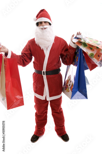 Young Man in Santa costume, full of gifts