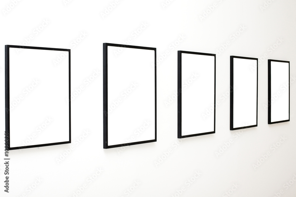 Five empty frames on white wall exhibition Five empty frames on white wall exhibition