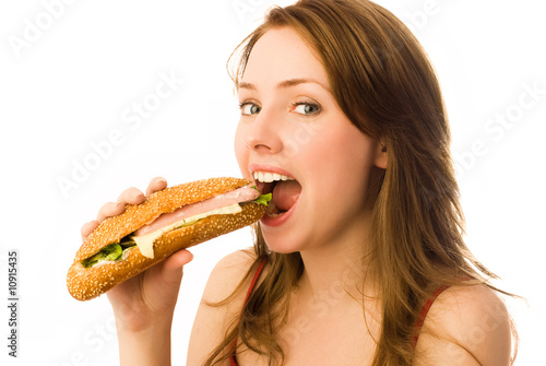 beautiful girl eating a hot dog