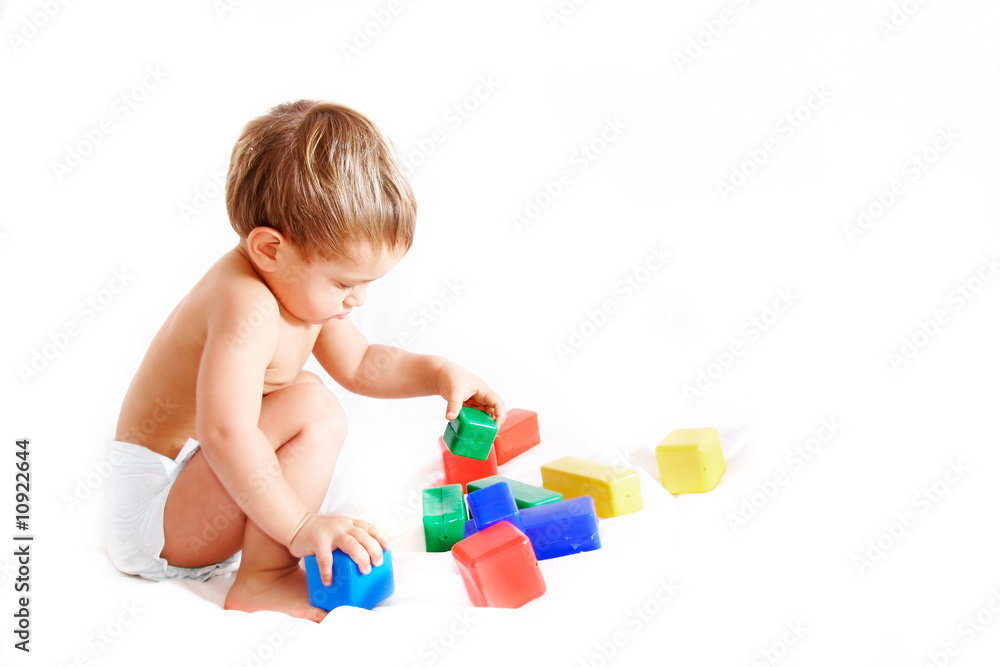 toddler playing with cubes over white toddler playing with cubes over white