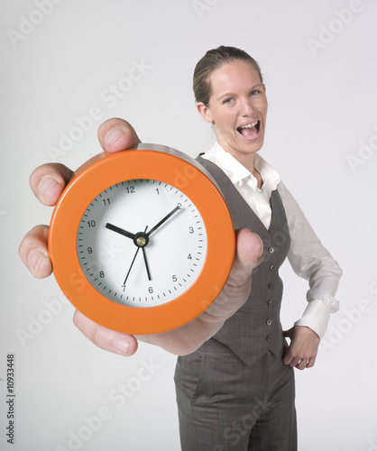 businesswoman holding alarm clock