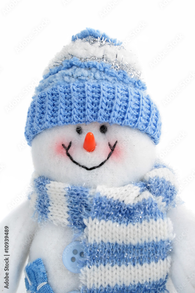 smiling snowman toy dressed in scarf and cap smiling snowman toy dressed in scarf and cap