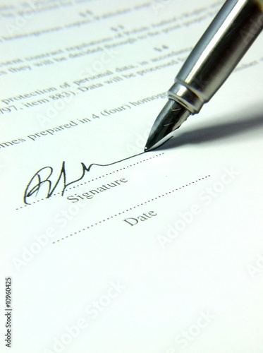 Fountain pen and signature on the contract