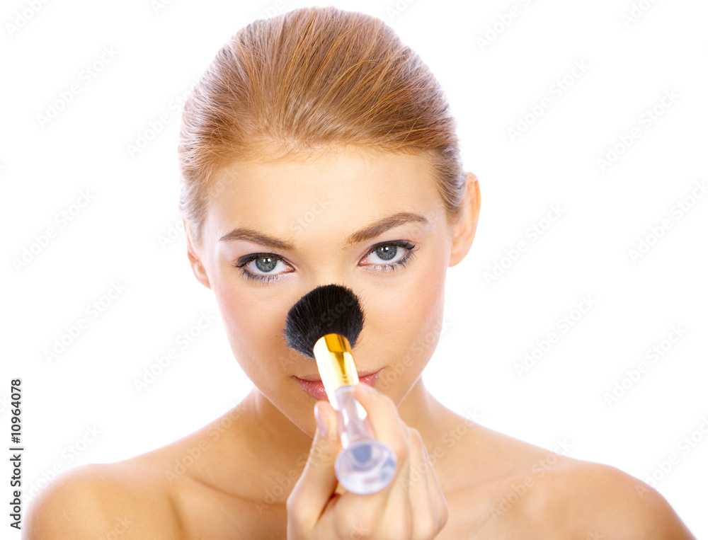 Portrait of beautiful blond woman doing makeup, on white Portrait of beautiful blond woman doing makeup, on white