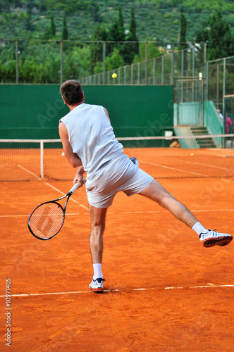 One man play tennis outdoors © .shock