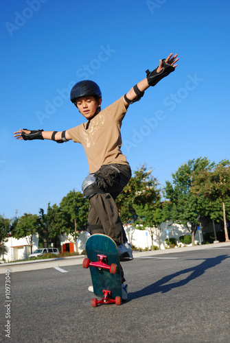 Boy Doing Stunts on a Skateboard