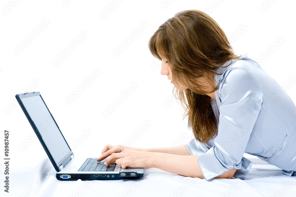 Young businesswoman with laptop lying on the floor. Young businesswoman with laptop lying on the floor.