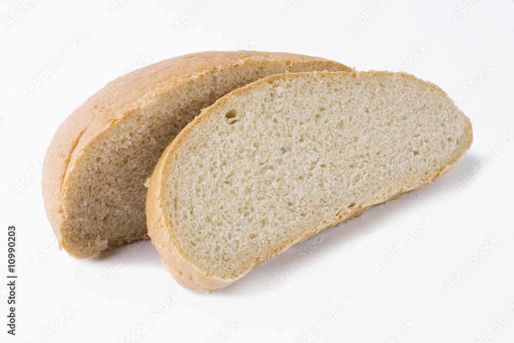 fresh baked bread sliced isolated over white background..
