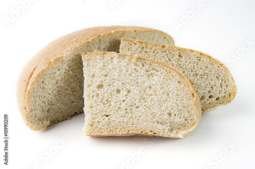 fresh baked bread sliced isolated over white background