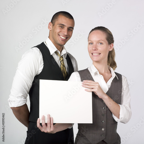 happy businesspeolpe holding blank notice photo